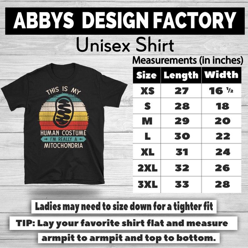May include: Black unisex t-shirt with a retro design. The shirt features the text "THIS IS MY HUMAN COSTUME I'M REALLY A MITOCHONDRIA" in a circular design. Measurements are provided in inches, with lengths ranging from 27 to 33 inches and widths from 16 1/2 to 28 inches.