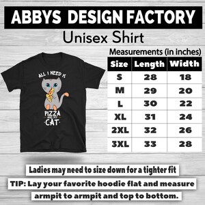 May include: Black unisex t-shirt with a graphic of a gray cat holding a pizza slice. Text on the shirt reads "ALL I NEED IS PIZZA AND MY CAT." Measurements chart in inches is also shown.
