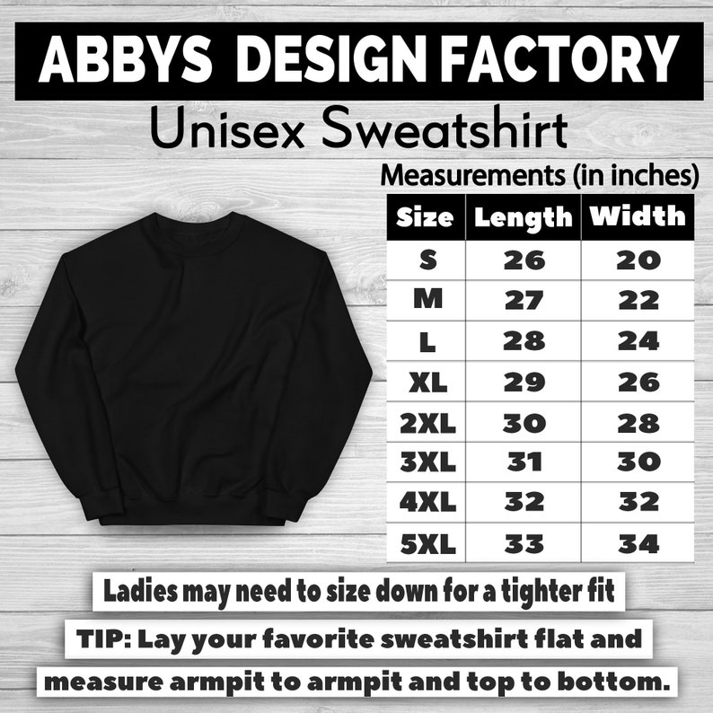 K&ouml;nnte beinhalten: Schwarzes Unisex-Sweatshirt mit dem Text "ABBYS DESIGN FACTORY" und einer Gr&ouml;&szlig;entabelle. Die Tabelle enth&auml;lt Ma&szlig;e in cm f&uuml;r die Gr&ouml;&szlig;en S bis 5XL, mit L&auml;ngen von 66 bis 84 cm und Breiten von 51 bis 86 cm.