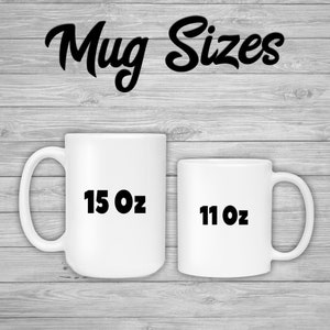 May include: Two white ceramic mugs of different sizes are displayed against a gray wood-grain background. The larger mug is labeled "15 Oz" and the smaller mug is labeled "11 Oz". The words "Mug Sizes" are written in a black, cursive font above the mugs.