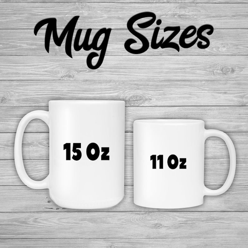 May include: Two white ceramic mugs of different sizes are displayed against a gray wood-grain background. The larger mug is labeled "15 Oz" and the smaller mug is labeled "11 Oz". The words "Mug Sizes" are written in a black, cursive font above the mugs.
