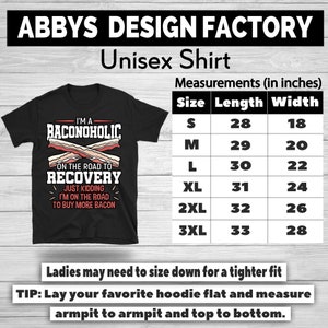 May include: Black unisex t-shirt with the text "I'M A BACONOHOLIC" and "ON THE ROAD TO RECOVERY" with bacon graphics. Includes a size chart with measurements in inches. The shirt is from Abbys Design Factory.