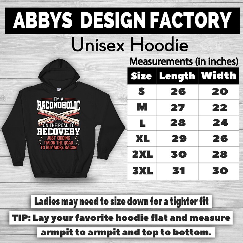 May include: Black unisex hoodie with the text "I'M A BACONOHOLIC ON THE ROAD TO RECOVERY...JUST KIDDING I'M ON THE ROAD TO BUY MORE BACON." Measurements are provided in inches. The hoodie is from Abbys Design Factory.