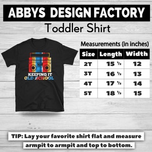 May include: Black toddler shirt with a retro boombox graphic in red, yellow, and blue. The text "KEEPING IT OLD SCHOOL" is below the boombox. Measurements in inches are listed for sizes 2T to 5T.