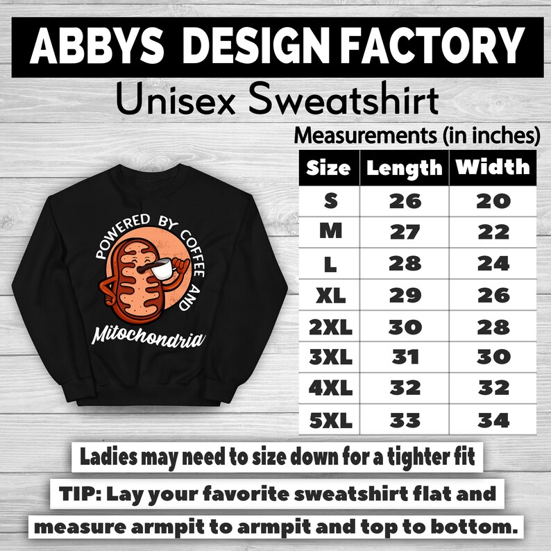 May include: Black unisex sweatshirt with the text "ABBYS DESIGN FACTORY" and "Unisex Sweatshirt". The sweatshirt features a graphic of a mitochondria holding a coffee cup with the words "POWERED BY COFFEE AND Mitochondria". Measurements are provided in inches.