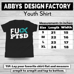 May include: Black youth shirt with the text "FUX PTSD" in white, with a teal ribbon graphic. Measurements are provided in inches: Size S (21" length, 15" width), M (22" x 16"), L (23" x 17"), and XL (24" x 18").