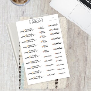 May include: A sheet of white paper with black and orange stickers. The stickers have text that says "Currently listening to", "New Credit", "Wishlist", and "Preorder".