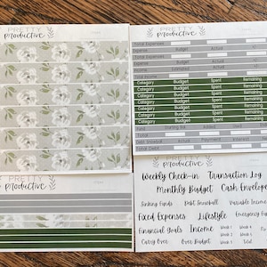 May include: A set of printable budget planner stickers with a green and white floral design. The stickers include sections for weekly check-in, transaction log, monthly budget, cash envelopes, sinking funds, debt snowball, variable income, fixed expenses, lifestyle, emergency fund, financial goals, income, carry over, over budget, no spend days, and savings.