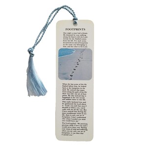 May include: A bookmark with the word "FOOTPRINTS" at the top, featuring a beach scene with footprints in the sand. The bookmark has a light blue tassel attached to the top.