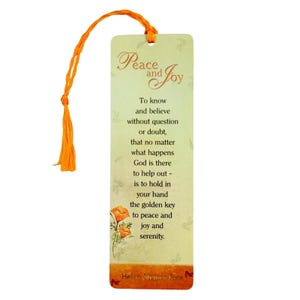 May include: A rectangular paper bookmark with a light green background, featuring an orange tassel at the top. It displays the text Peace and Joy, followed by a poem about faith, and includes a small orange flower illustration at the bottom left.