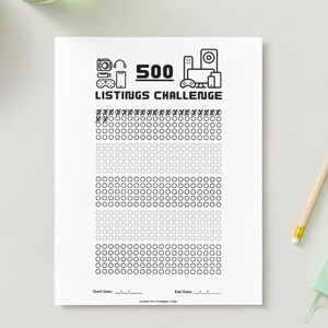 May include: A white paper with the text "500 Listings Challenge" and a grid of circles for tracking progress. The top of the paper has icons of a camera, phone, and other electronics. The paper includes spaces for start and end dates.