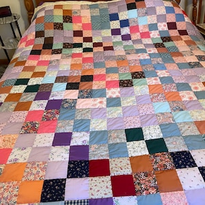 Gorgeous Scrappy Quilt with lots of NOS vintage fabrics hand quilted & finished with triangle points around the quilt generous size 92”x85”