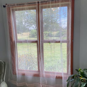 Pair Gorgeous Vintage 1960’s white netted sheer curtains Each panel is 39”x72” w very faint draping bunting with rose design printed on lace