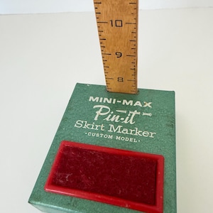 Vintage sewing tool dressmaker’s skirt marker with pin cushion. Use for marking hems or vintage sewing room decor! Mini-max Pin-It custom