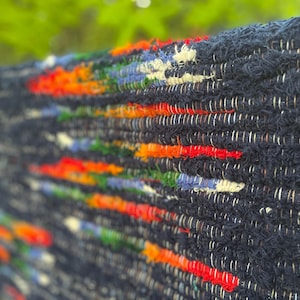 Handmade Wool textured Rug “This Rug is on FIRE!!” 32”x29” deep midnight blue color with orange/red“fire”, hints of blue, cream, and green