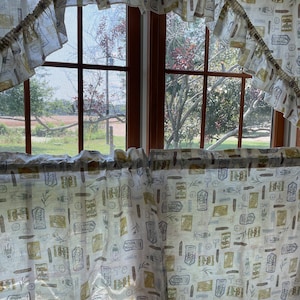 1980’s vintage curtains  ruffled swag valance 57” wide and cafe tiers 20”x27” long with a garden seed packet theme harvest gold lilac brown
