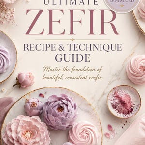 May include: A digital guide titled Ultimate Zefir Recipe & Technique Guide by Fortunabotanique, featuring text and images of pink and purple flower-shaped meringue confections on a marble surface with a piping bag and fresh floral accents.