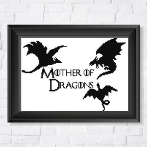 May include: Black and white image of three dragons with the text "Mother of Dragons" in the centre.