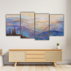 May include: A multi-panel canvas painting depicting a landscape with rolling hills, a small town in the distance, and a sky with a soft, golden glow. The painting is done in shades of blue, purple, and green.