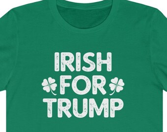 May include: Green t-shirt with the text "IRISH FOR TRUMP" in white, featuring shamrock designs. The shirt is made of a soft material and has short sleeves.