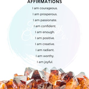 May include: A motivational poster with a light blue background and a white circle in the centre. The circle has a light blue watercolour effect. The text on the poster reads "Sacral Chakra Affirmations" and lists affirmations such as "I am courageous", "I am prosperous", "I am passionate", "I am confident", "I am enough", "I am positive", "I am creative", "I am radiant", "I am worthy", and "I am joyful". The bottom of the poster features a close-up of a cluster of orange and brown crystals.