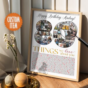 May include: A white poster with a photo collage of 80 photos arranged in the shape of the number 80. The text "Happy Birthday Audrey!" is at the top of the poster. Below the photo collage is the text "80 THINGS we love about you" with red hearts scattered throughout the text.