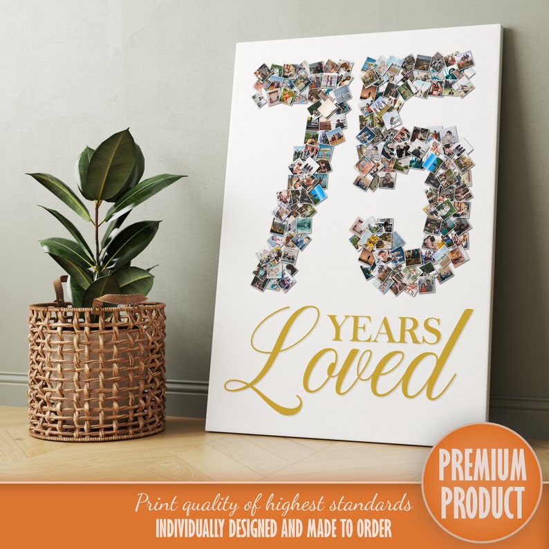 May include: A white canvas print featuring a gold number 75 created from photographs. The words "YEARS Loved" are written in gold cursive below the number. The print is displayed on a wooden floor with a potted plant in a wicker basket to the left.