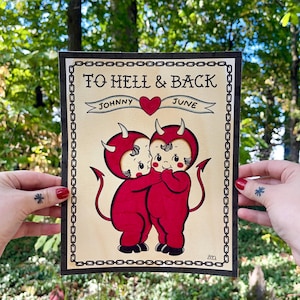 May include: A vintage-style illustration of two red devil characters with horns and tails, hugging each other. The illustration is framed with a black chain border and includes the text "To Hell & Back", "Johnny", "June", and "2020".