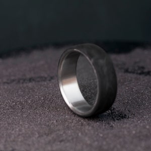 Engagement Ring: Begin your journey with this timeless titanium beauty.