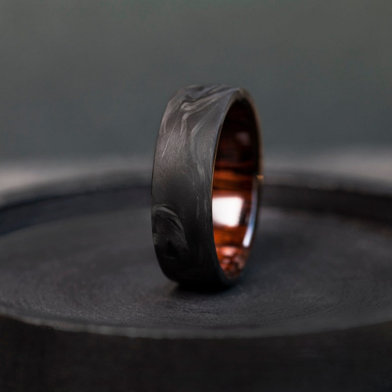 Carbon Fiber and Ironwood Ring: Nature and technology unite in elegance.