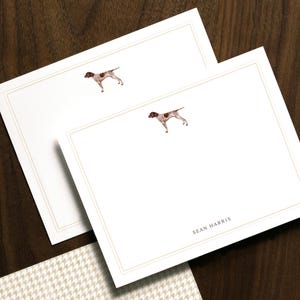 May include: Stationery set featuring white notecards with a watercolor illustration of a dog and a houndstooth patterned card. The notecards have a thin border and the name "SEAN HARRIS" printed at the bottom. The houndstooth card has the name "HART" printed at the bottom.