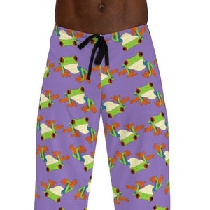 May include: Purple pyjama trousers with a repeating pattern of green tree frogs with orange and white accents.