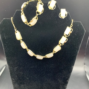 Coro vintage white plastic/lucite moonstone gold tone necklace, bracelet and clip earrings.