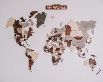 May include: A wooden world map puzzle with the words "MY WORLD" on a sign at the top. The map is made of different shades of brown and gray wood and each country is a separate piece.