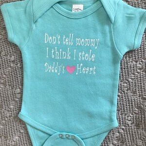 Don’t tell mommy I stole daddies heart baby onesie