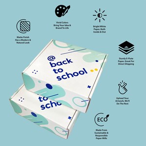 May include: Two white cardboard boxes with a colorful abstract design and the text "@back to school" and "to sch" printed on them. The boxes are stacked on top of each other.