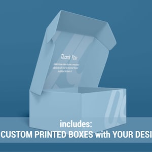 May include: A light blue cardboard box with the words "Thank You" and "includes: 25 CUSTOM PRINTED BOXES with YOUR DESIGN" printed on it. The box is open and the inside is visible.