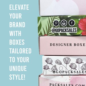 May include: A stack of four different boxes with various designs. The top box has a tropical leaf pattern with pink flowers and the text "@GOPACKSALES". The second box is pink with the text "DESIGNER BOXE". The third box has a white background with black line drawings of flowers and the text "@GOPACKSALES". The bottom box is white with the text "PACKSALES.COM".