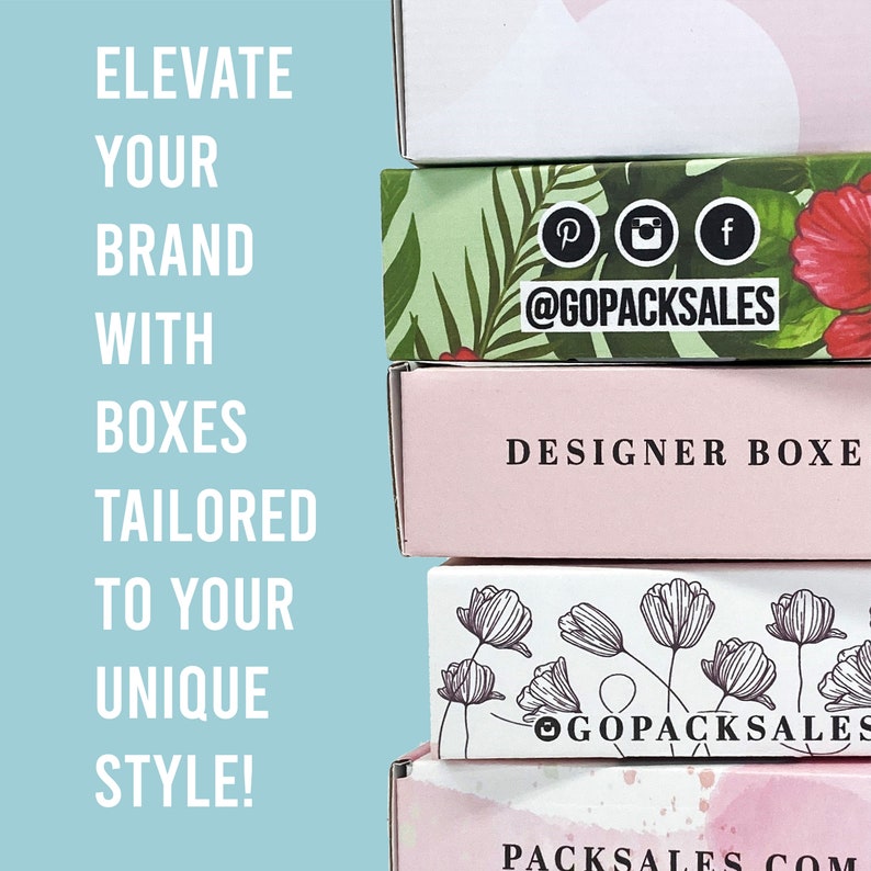 May include: A stack of four different boxes with various designs. The top box has a tropical leaf pattern with pink flowers and the text "@GOPACKSALES". The second box is pink with the text "DESIGNER BOXE". The third box has a white background with black line drawings of flowers and the text "@GOPACKSALES". The bottom box is white with the text "PACKSALES.COM".