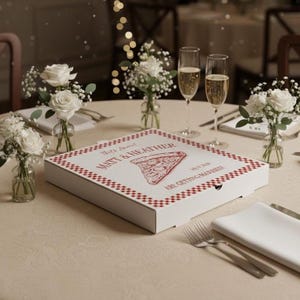 May include: A white pizza box with a red checkered border and the words "MATT & HEATHER" printed on the top. A slice of pizza is illustrated in the center. The box is on a table set for a wedding.