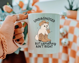 Undiagnosed but something ain't right Mug, Cat Cowboy Drink Coffee, Vintage Yee Haw Funny Mental Health Cat Lover Cup