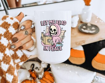 Let Me Read in Peace Spooky Bookish Mug | Skeleton Reading Coffee Cup | Spooky Cute Halloween Reader Gifts | Bookish Fall Mug | Cute Goth