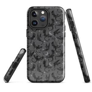 May include: Black phone case with a pattern of bats and stars. The case has a built-in ring holder.