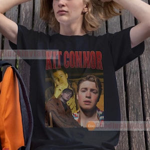 May include: A black t-shirt with a red and white graphic print of Kit Connor. The graphic features a collage of three photos of Kit Connor.