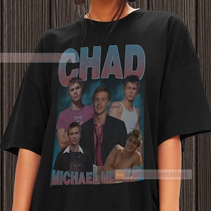 May include: Black t-shirt with a vintage-style graphic of a band called "Chad" featuring Michael Murray. The graphic includes a collage of five band members with the band name in large, colorful letters.