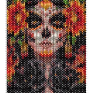 May include: A bead weaving pattern chart featuring a stylized face with dark eye sockets, surrounded by vibrant orange and red floral elements against a black background. The grid contains alphanumeric codes for bead colors and page numbering.