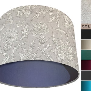 May include: A grey lampshade with a white thistle floral pattern. The lampshade has a blue lining. The image shows a colour chart with various colours for the lampshade.