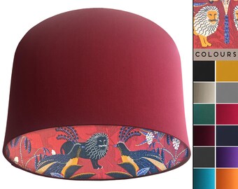 Block Print Style Tropical Lampshade with Red Animal Themed Pattern.