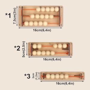 May include: Wooden abacuses of varying sizes. The largest is 3 inches tall and 6.4 inches wide, with three rows of wooden beads. The other two are 2.5 inches and 1.2 inches tall, respectively, and 6.4 inches wide. Each has wooden beads on rods.