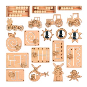 May include: A collection of wooden educational toys, including an abacus, tractors, a caterpillar, and various shape and maze boards. The toys are made of light-colored wood and feature moving parts and gears. The set includes a helicopter, a windmill, and a propeller plane.